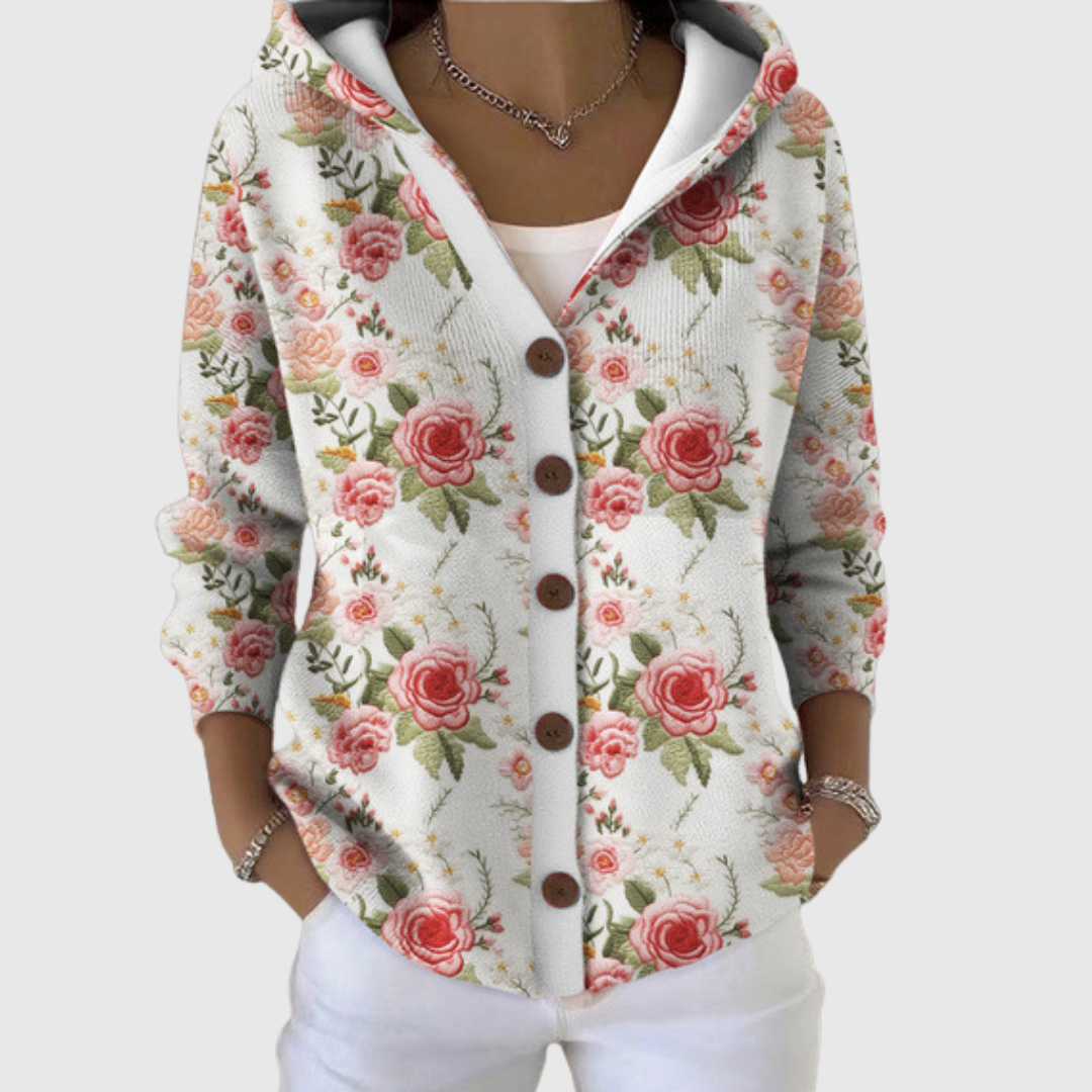 A woman wearing a soft hooded comfort cardigan open over a top on a mild day