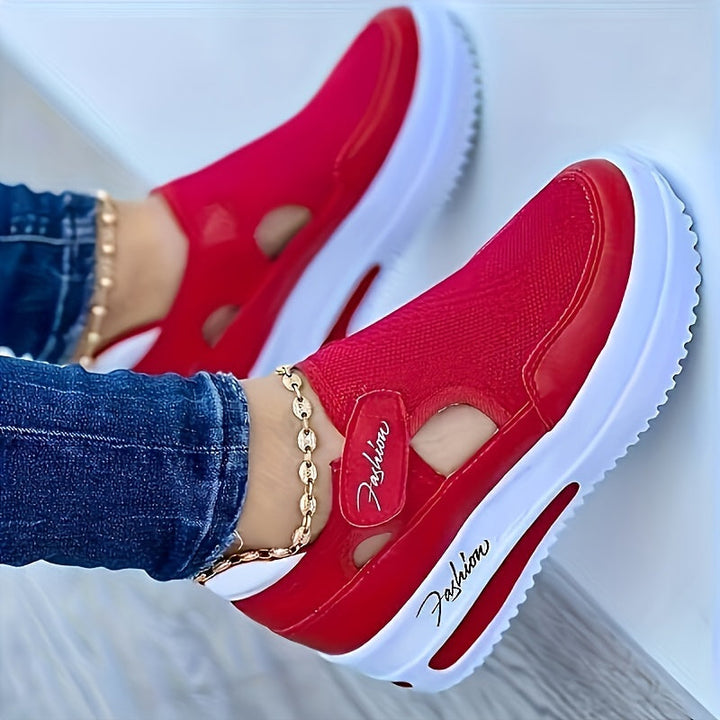 A woman slipping on breathable, cushioned slip-on sneakers with pants