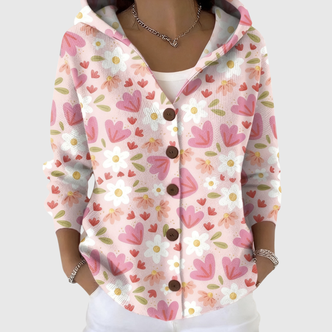 A woman wearing a cosy hooded cardigan, relaxed and warm on a mild day