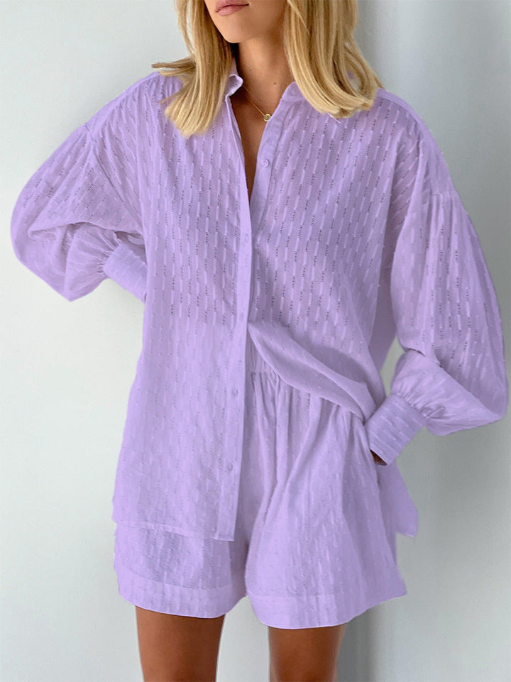 A woman wearing a classic button shirt with matching relaxed shorts, polished and easy.