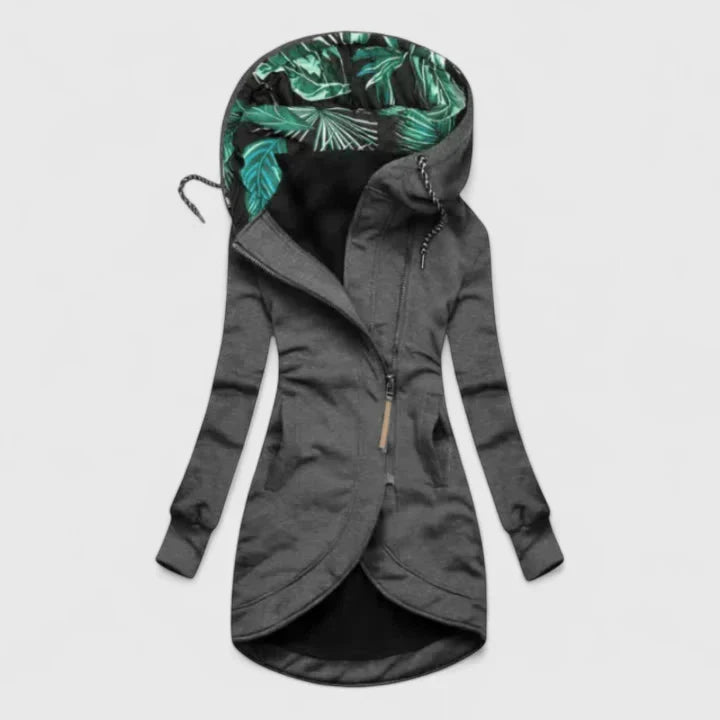 A navy hooded zip-up jacket with a leaf-print hood lining and a longer curved hem