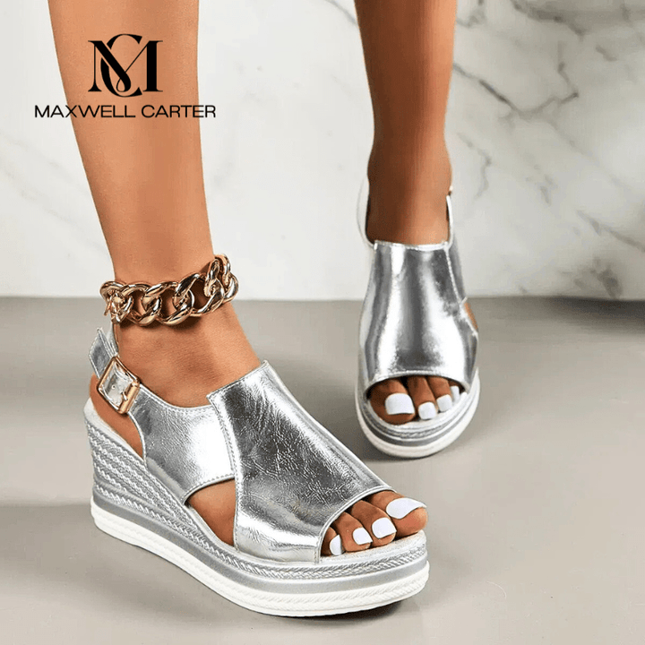 A woman wearing gold metallic sandals with a cushioned insole and wide, supportive fit.