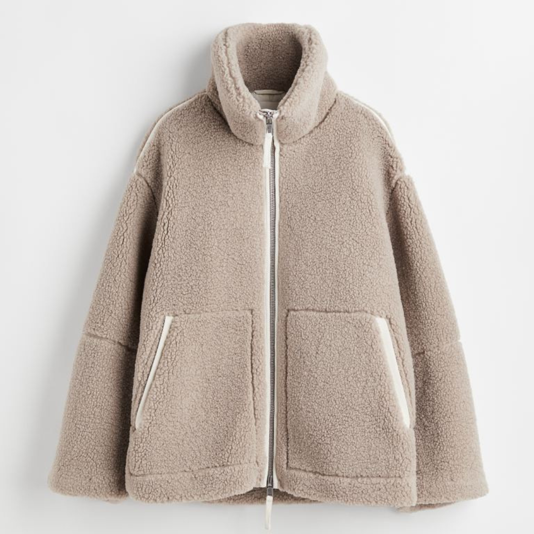 A soft, textured winter jacket with a tall stand collar, zip front and patch pockets