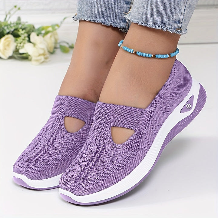 A woman stepping into easy slip-on comfort sneakers with no laces.