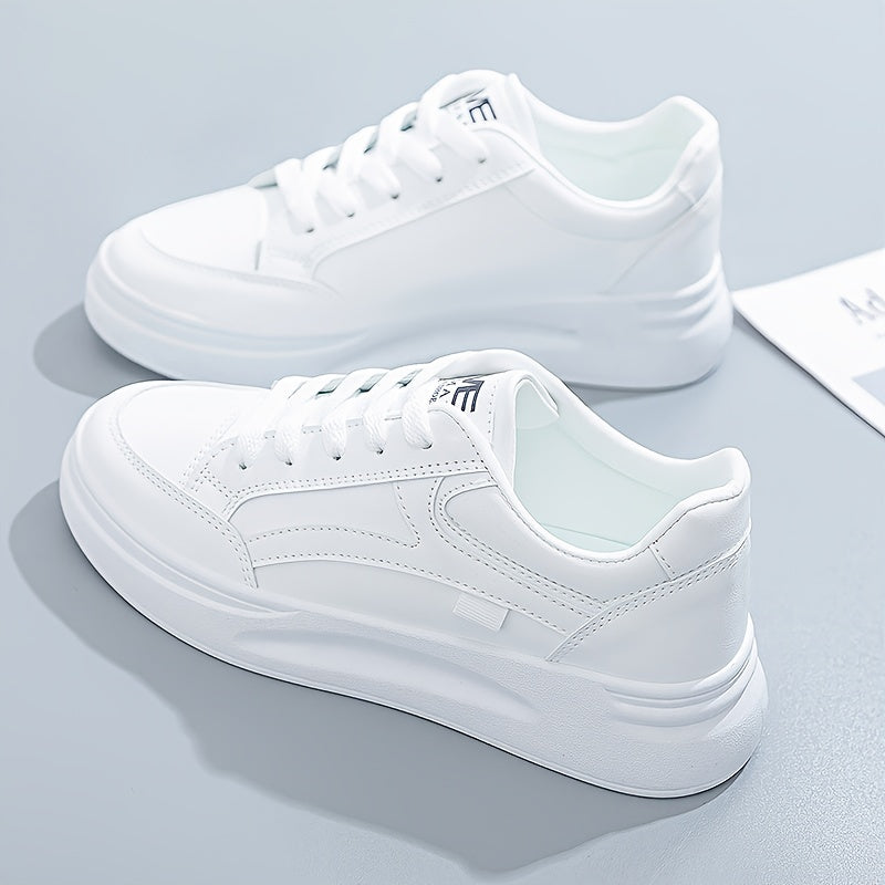 A woman in crisp white light comfort sneakers paired with jeans.