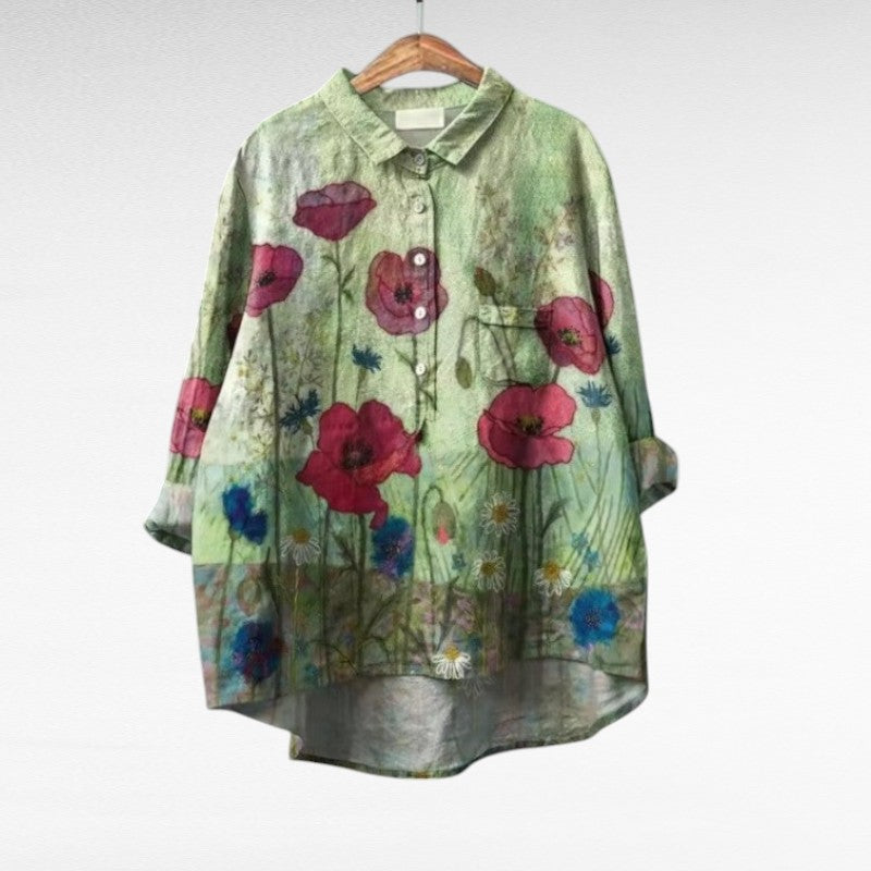 Woman wearing a featherlight printed summer blouse with a gently flowing fall.