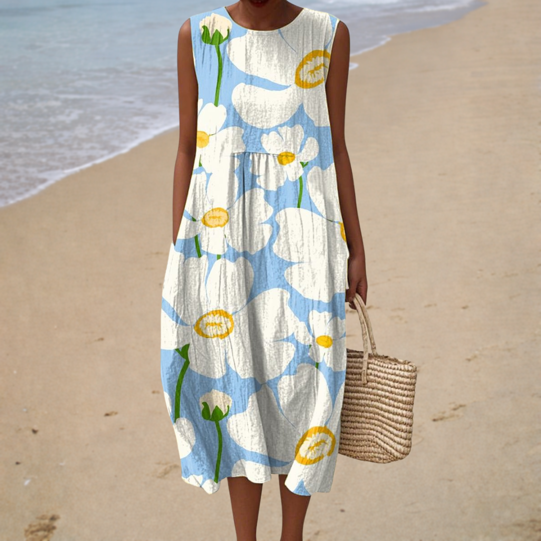 A woman wearing a sleeveless printed summer dress, light and breezy on a warm day.