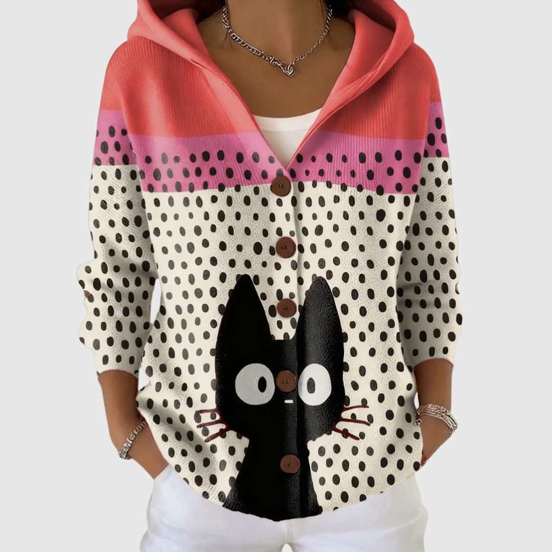 A woman wearing a soft hooded cardigan, comfortable from morning to evening on a mild day