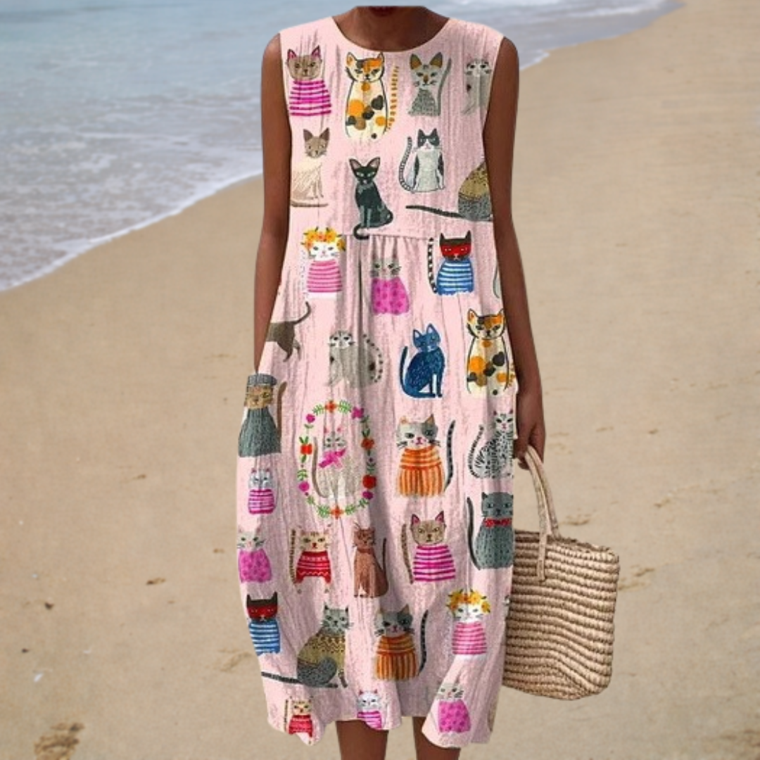 A woman wearing a light sleeveless patterned summer dress, cool and relaxed on a warm day.