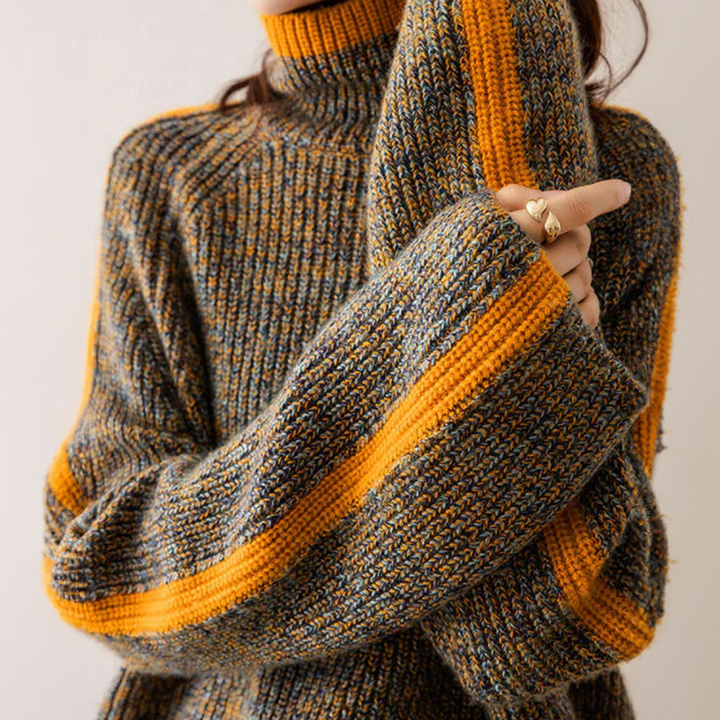 A woman wearing a softly textured everyday sweater with a relaxed modern line.