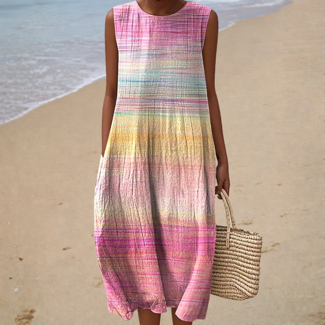 A woman wearing a sleeveless printed summer dress, cool and elegant on a hot day.