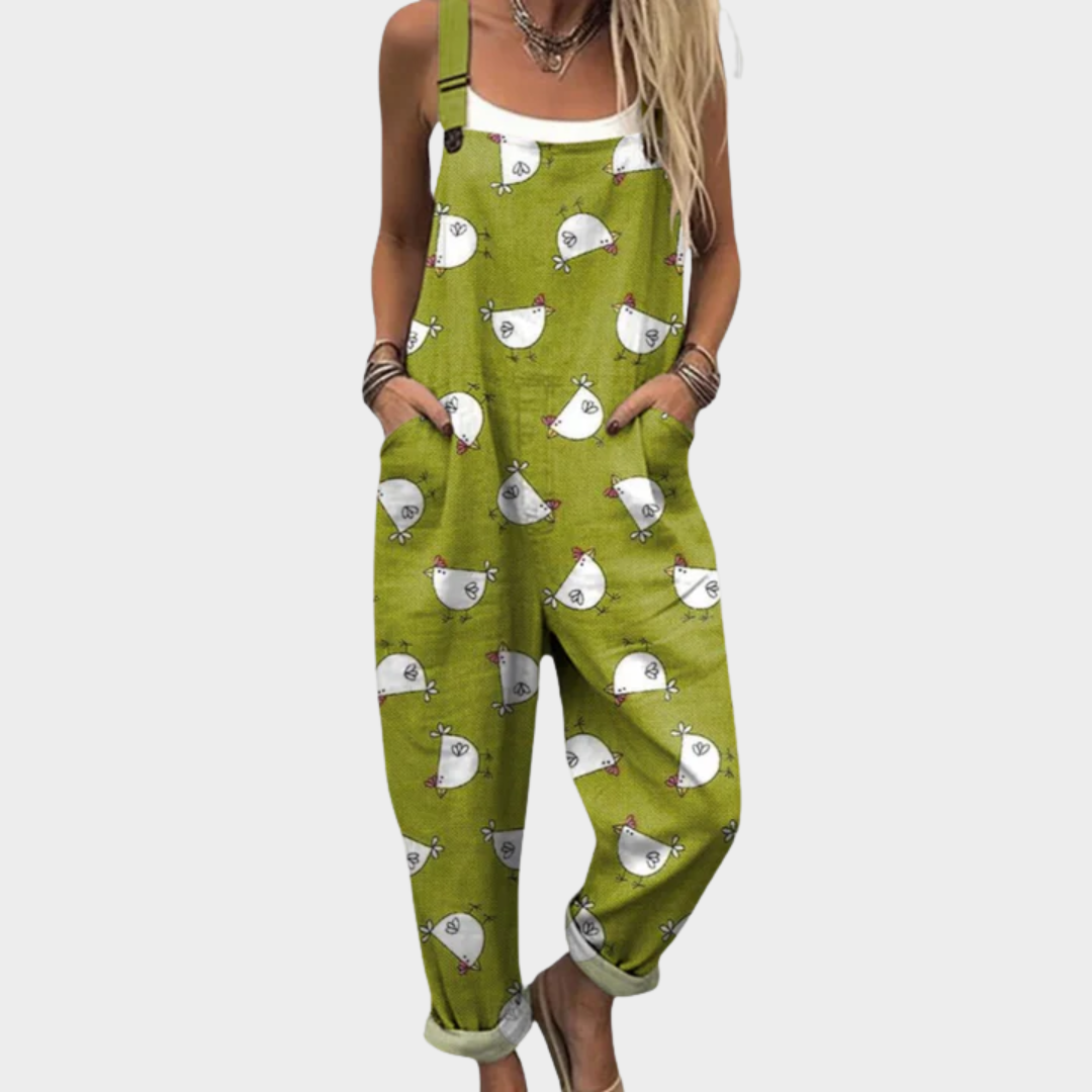 Woman wearing fresh green overalls printed with little white hens