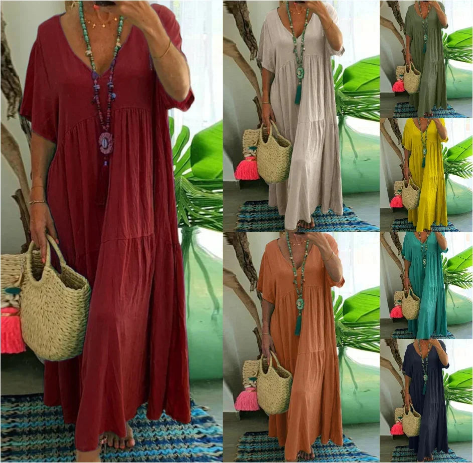 Woman wearing a relaxed V-neck maxi dress with a soft, flowing drape.