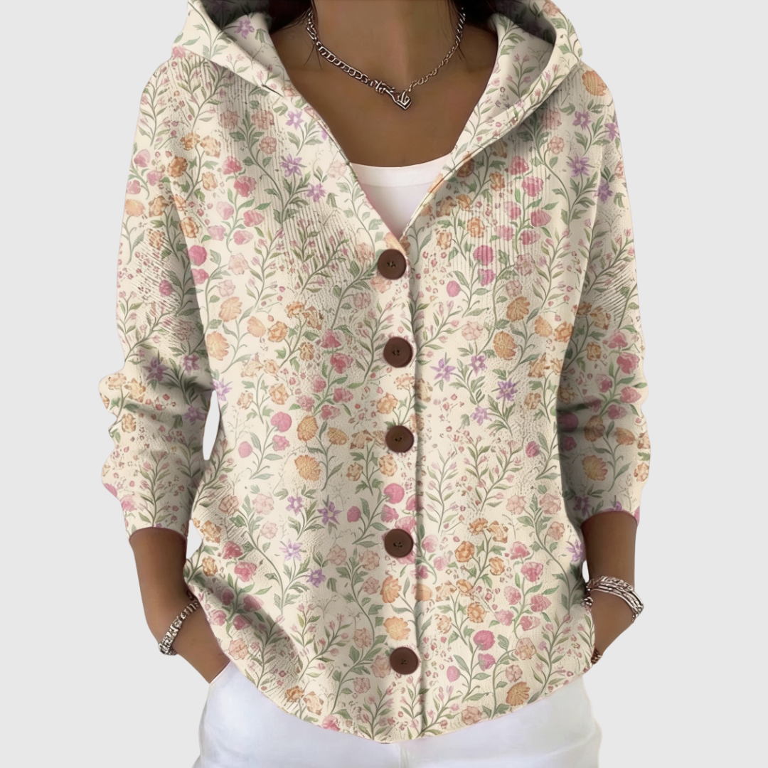 A woman wearing a relaxed hooded cardigan open over a top on a mild day