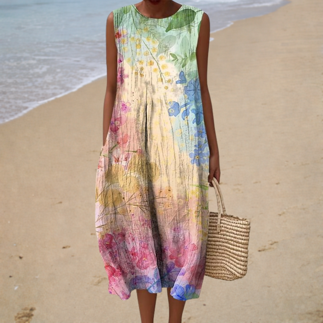 A woman wearing an airy sleeveless summer dress with a refined pattern, cool and relaxed in the heat.