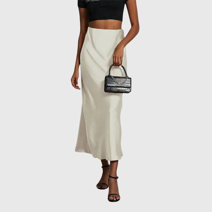 A woman in a fitted fishtail skirt with a flared hem, styled elegantly for a special occasion.