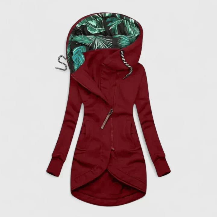 A navy hooded zip-up jacket with a leaf-print hood lining and a longer curved hem
