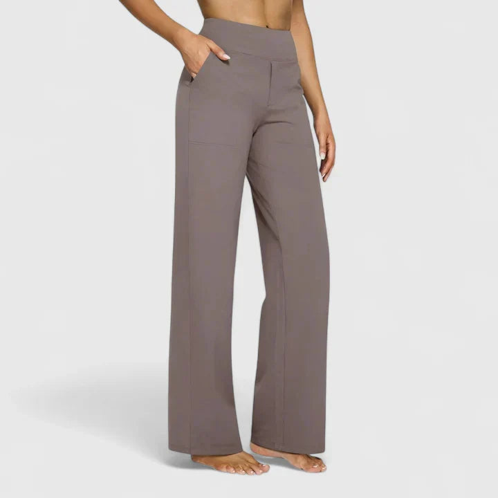 A woman in elegant straight-leg pants with pockets, styled for a polished everyday look.