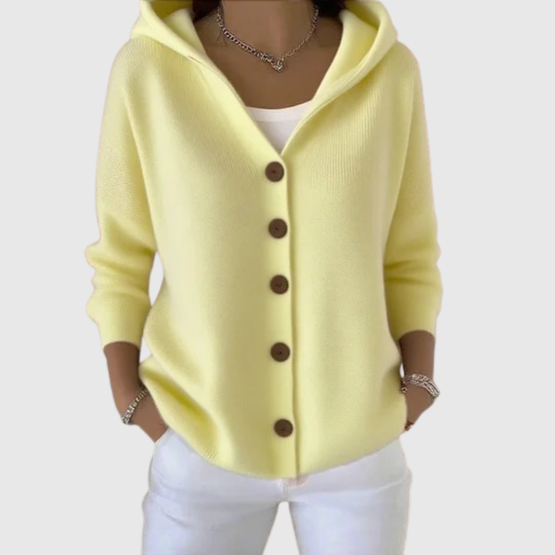 A woman wearing a hooded button cardigan open over a top for a relaxed everyday look.