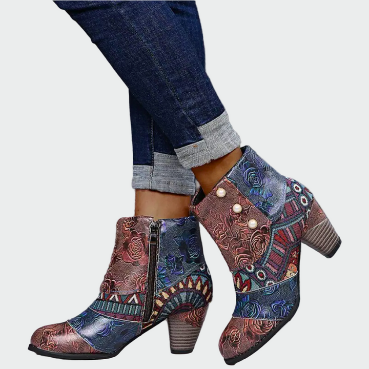 Woman wearing colourful boho-chic patterned boots with jeans on a bright day.