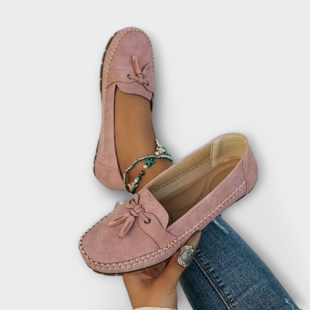 A woman wearing classic loafers on an easy day in town.