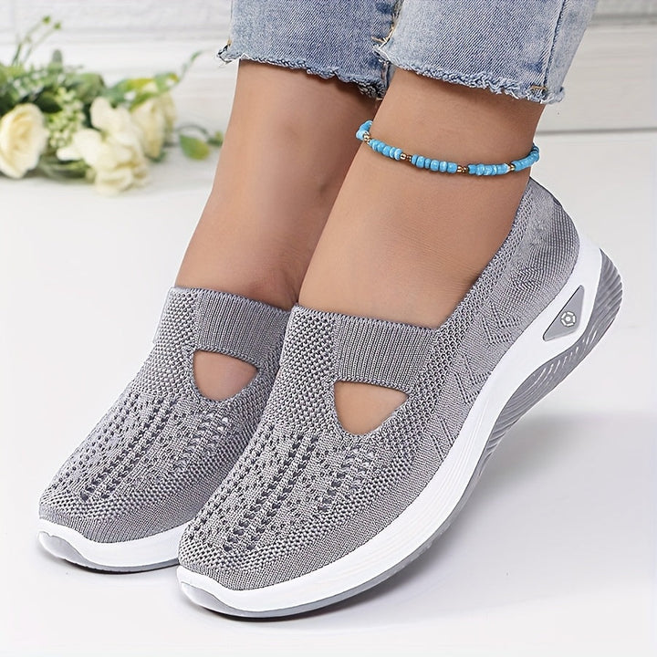 A woman stepping into easy slip-on comfort sneakers with no laces.