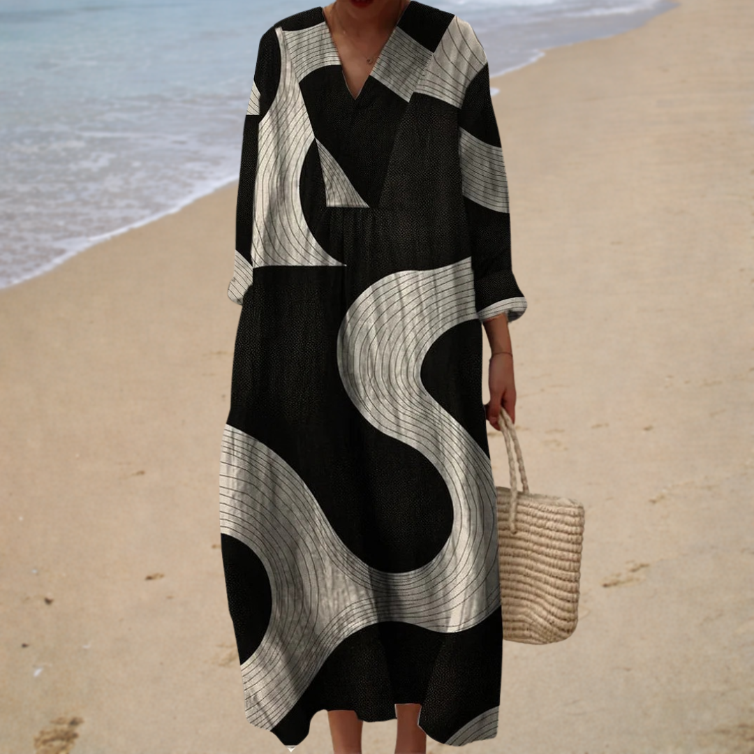 A woman in a flowing printed dress that sways softly around her as she walks through town.