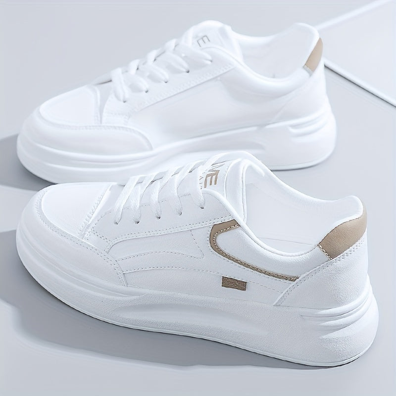 A woman in crisp white light comfort sneakers paired with jeans.