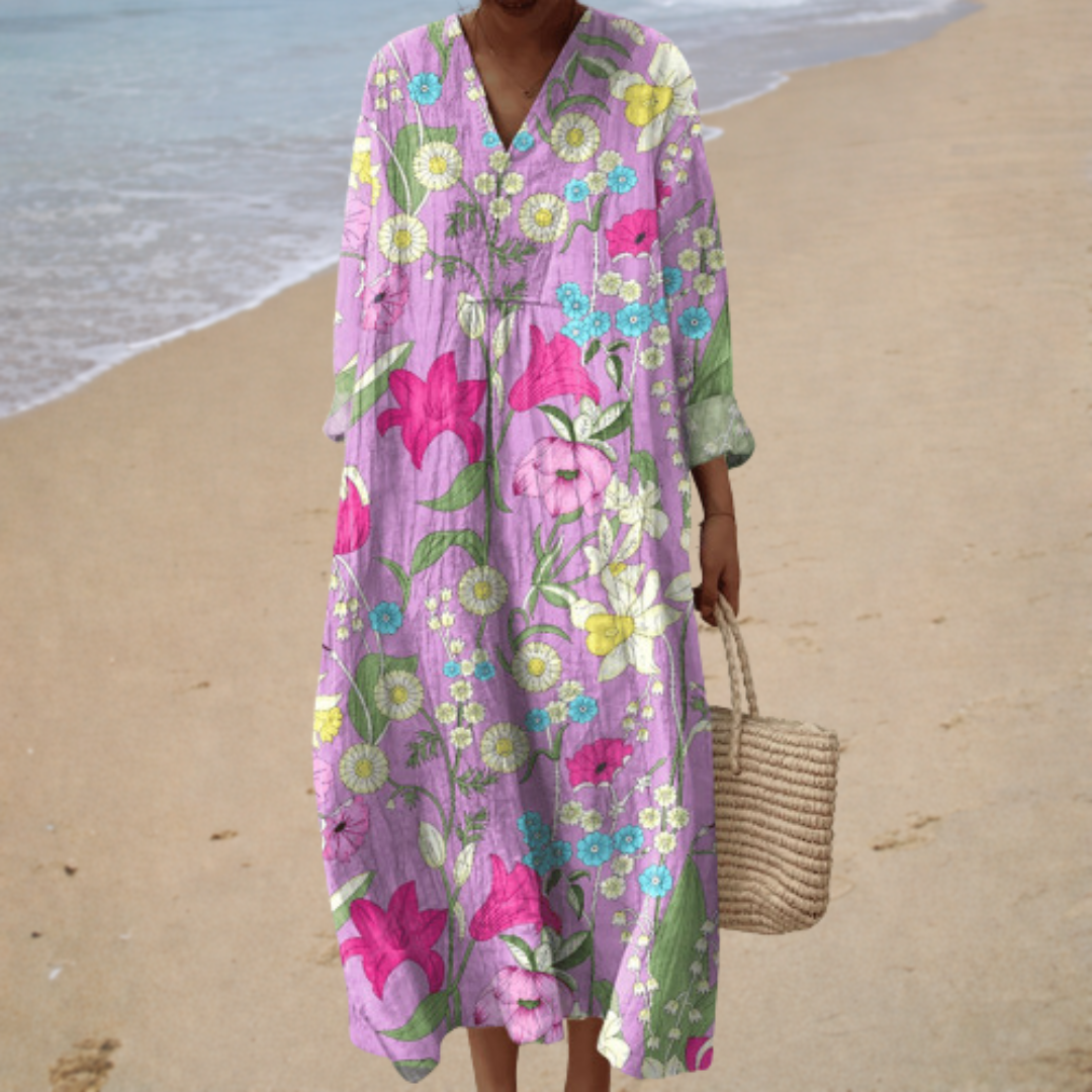 A woman wearing a fluttering printed summer dress that sways gently in the warm summer sun.