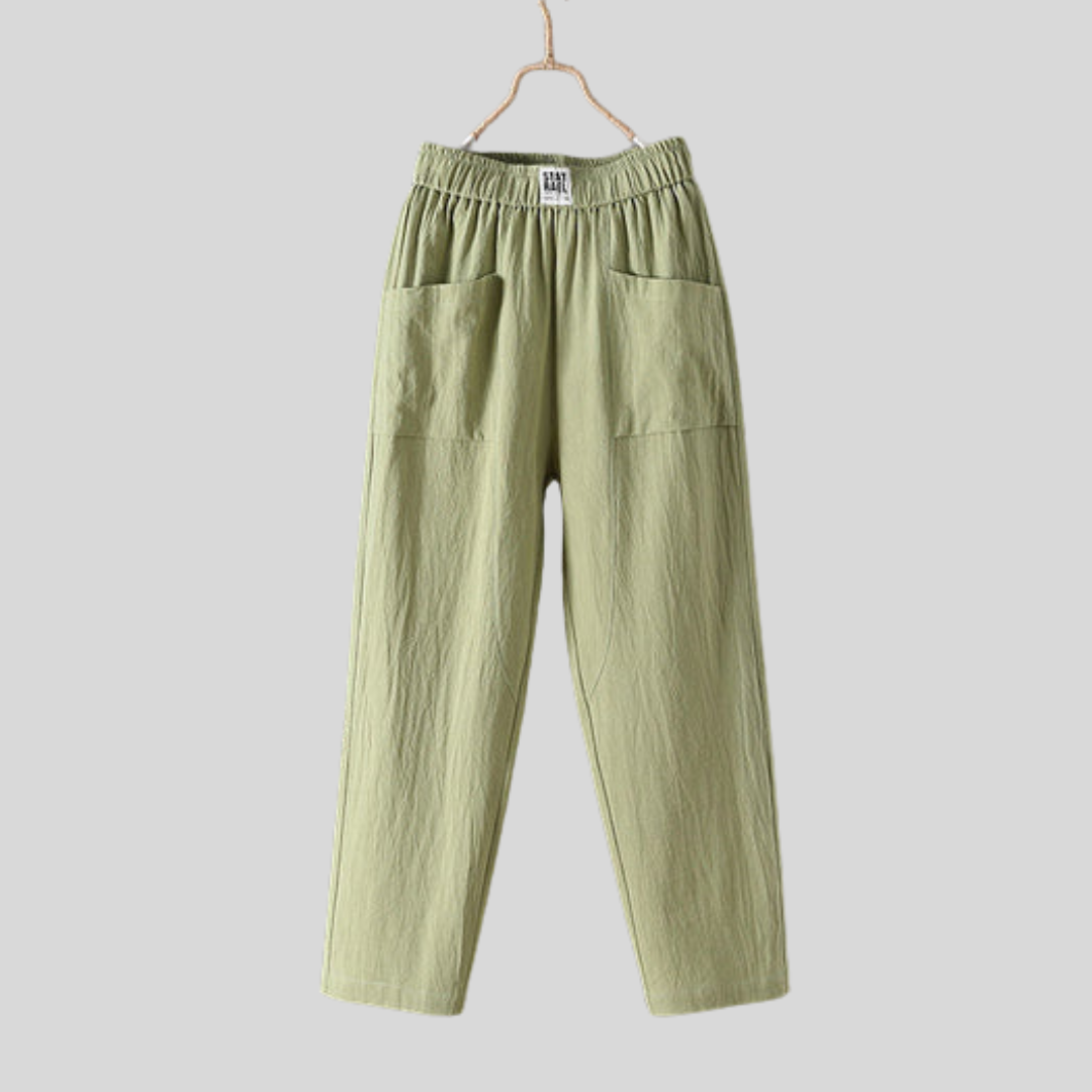 Relaxed tapered pants with roomy front patch pockets and an elastic waist.