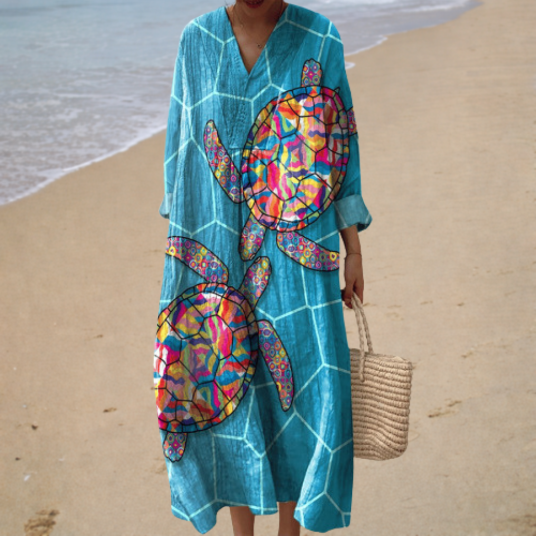 A woman wearing a fluttering printed summer dress that moves gracefully with every step.