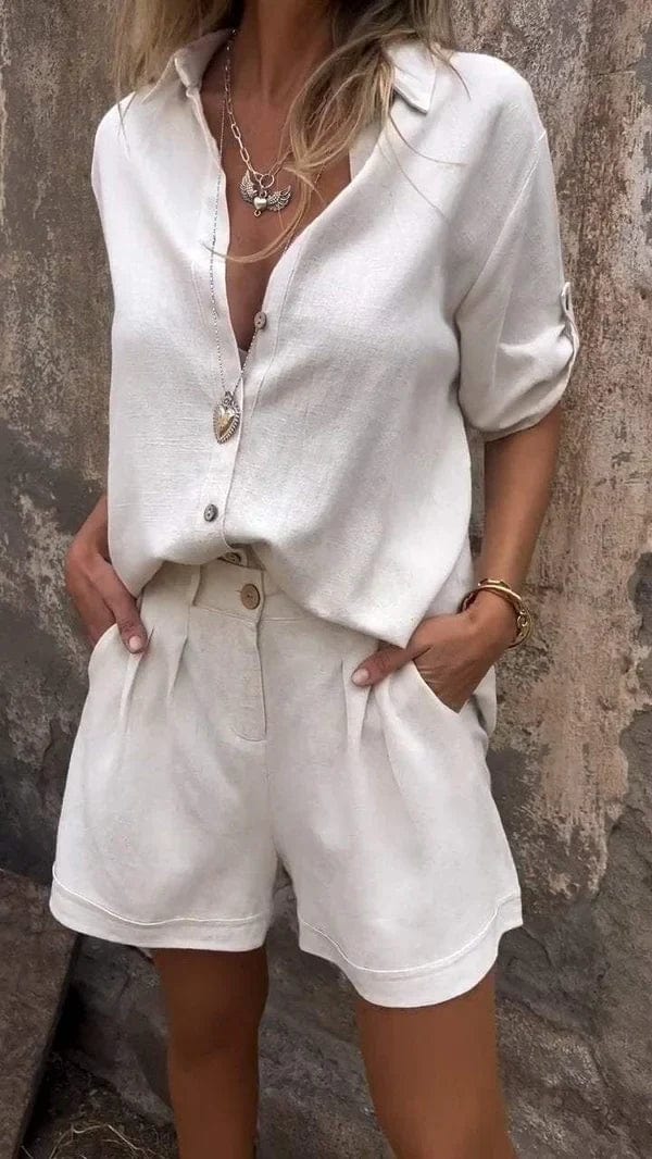 A woman in a coordinated button top and shorts set, styled for an easy sunny summer look.