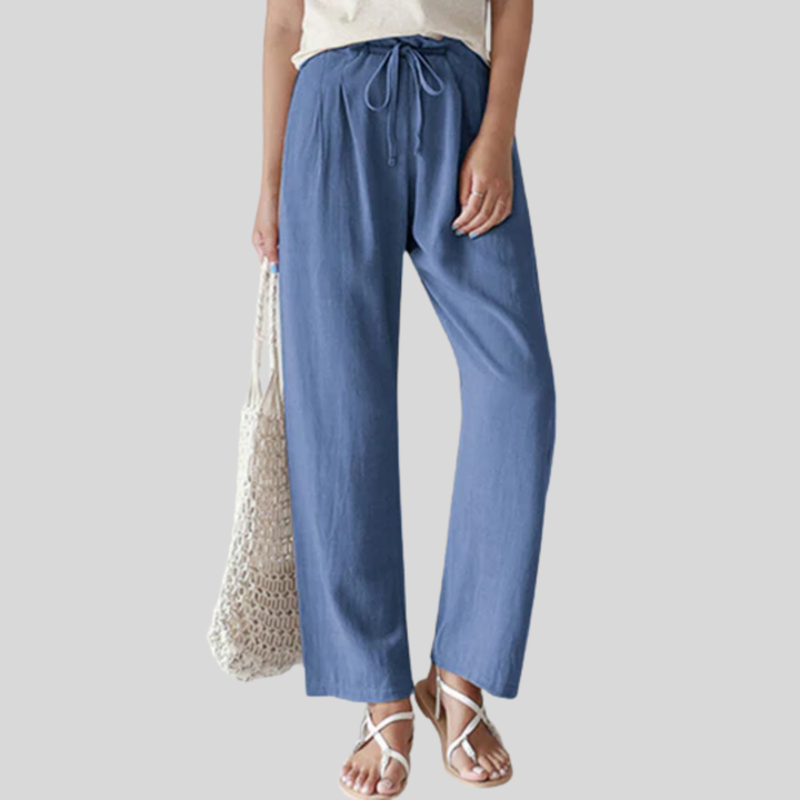 A woman walking outdoors in relaxed drawstring pants with an easy, comfortable everyday look.
