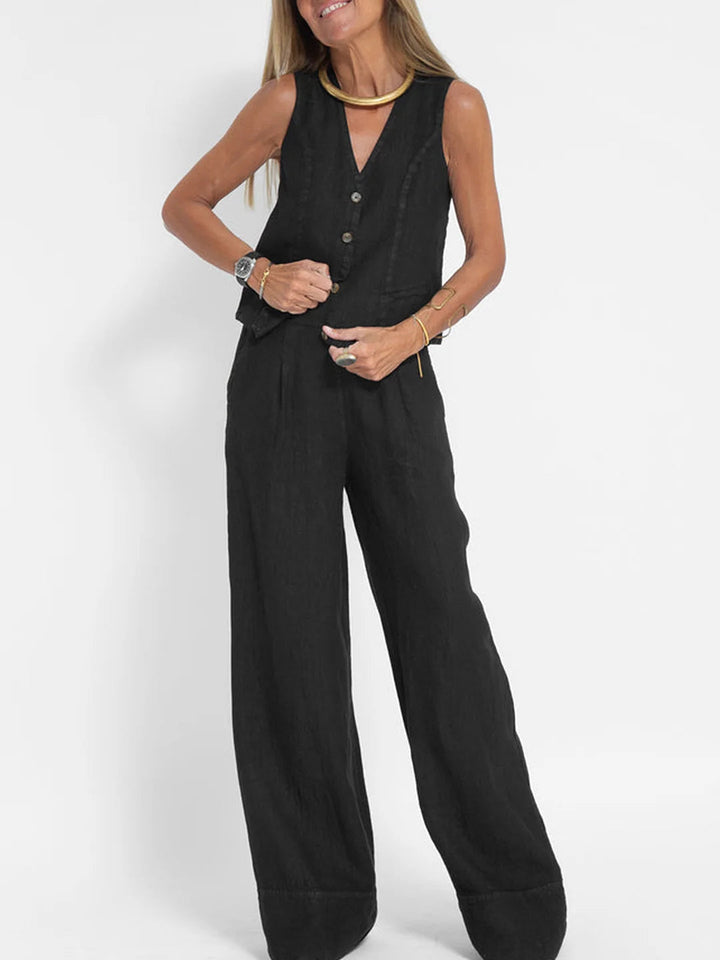 A woman wearing a tailored waistcoat with flowing wide-leg pants