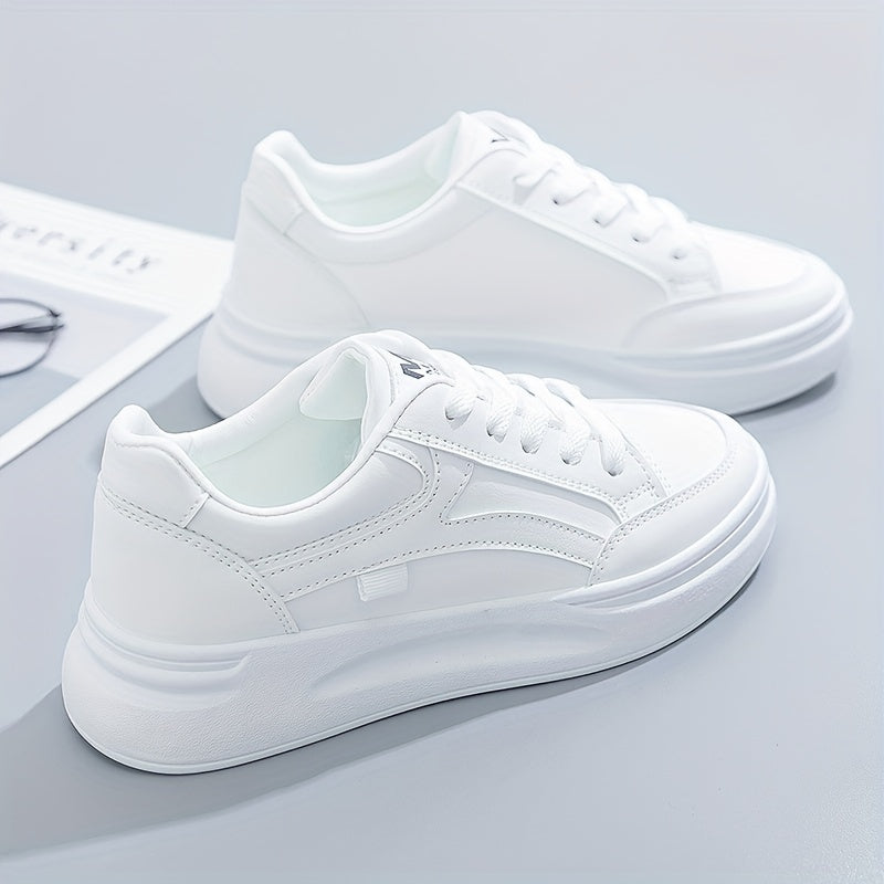 A woman in crisp white light comfort sneakers paired with jeans.