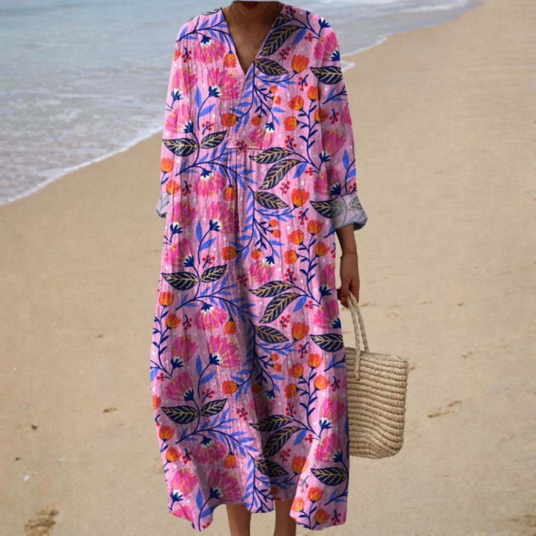 A woman wearing a fluttering printed summer dress that drifts gently in the warm breeze.