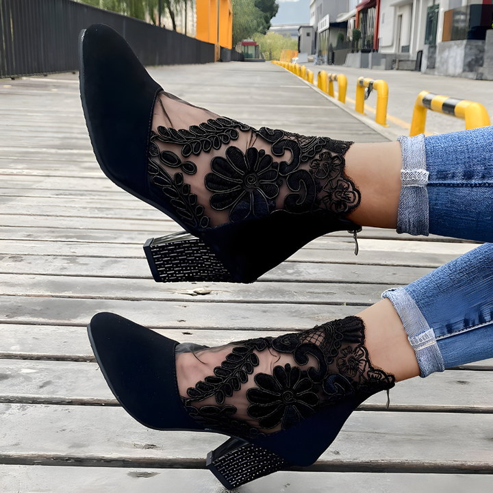 A woman in wide-fit comfort heels standing comfortably through a busy day out.