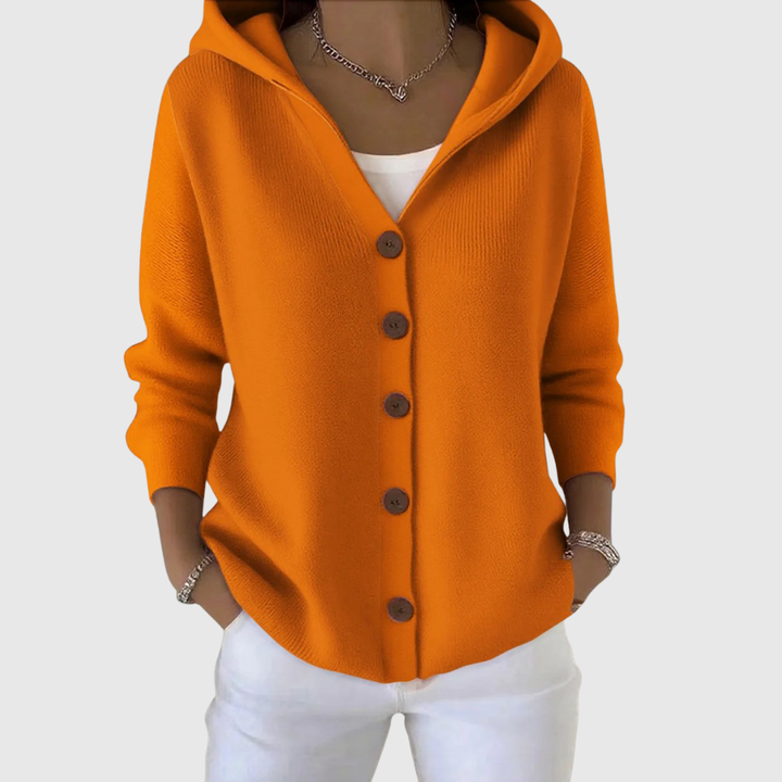 A woman wearing a hooded button cardigan open over a top for a relaxed everyday look.