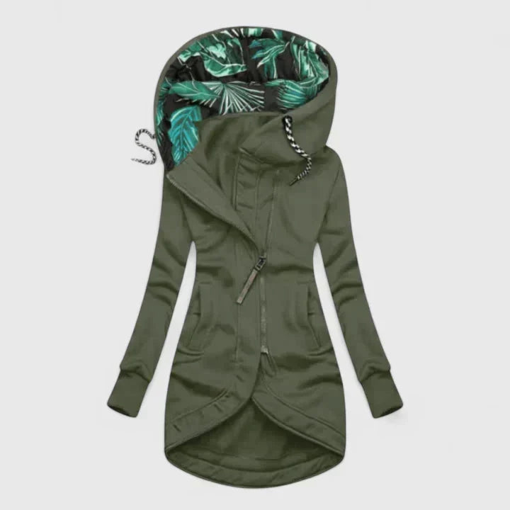 A navy hooded zip-up jacket with a leaf-print hood lining and a longer curved hem