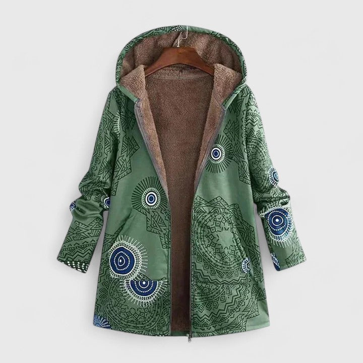 A woman wearing a geometric-print boho jacket, warmly layered on a winter day out.