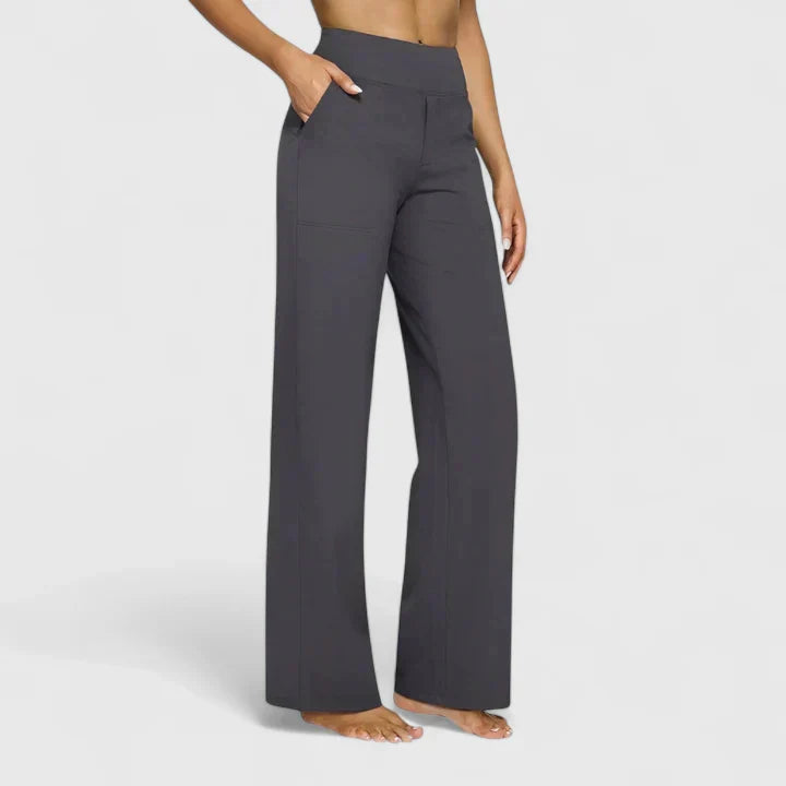 A woman in elegant straight-leg pants with pockets, styled for a polished everyday look.