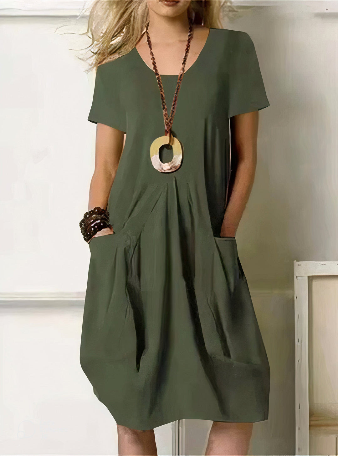 Woman wearing the Paula™ A-line midi dress with pockets and a round neckline, out on an everyday errand.