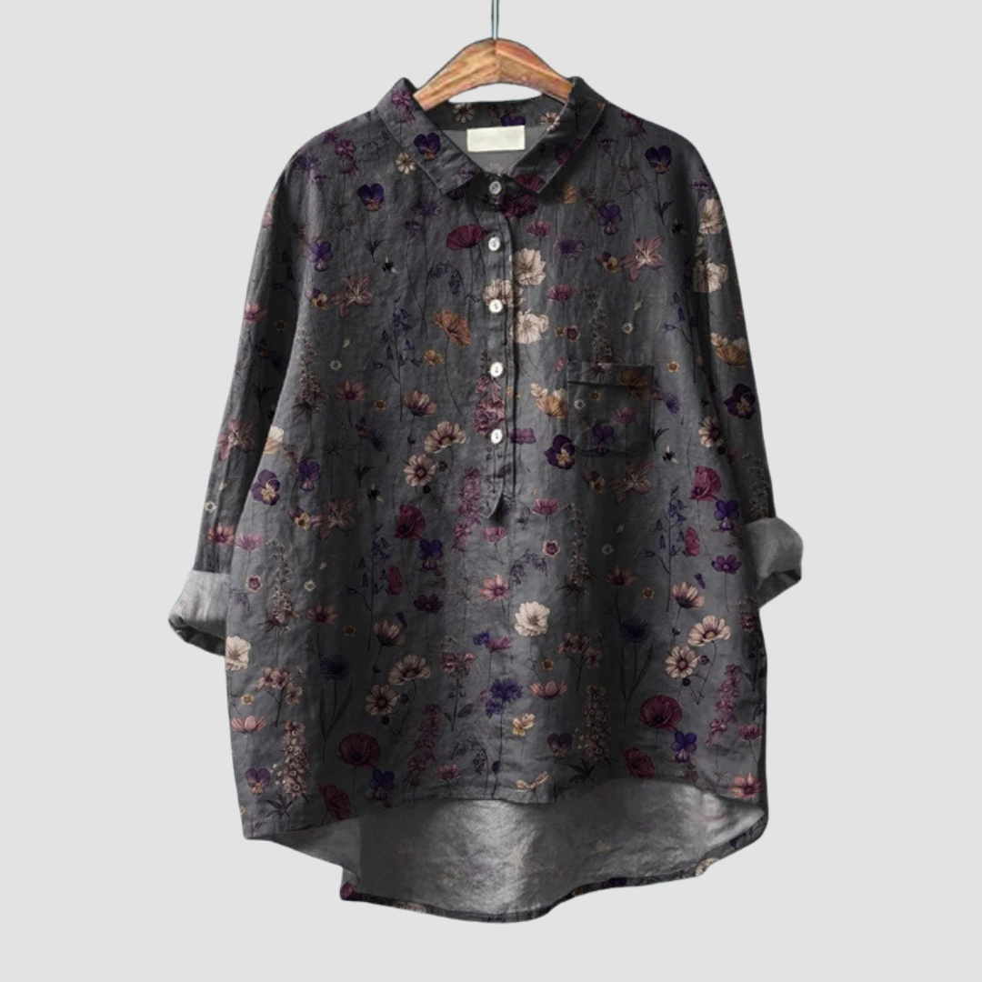 Woman wearing a breezy printed summer blouse with a soft, flattering flow.