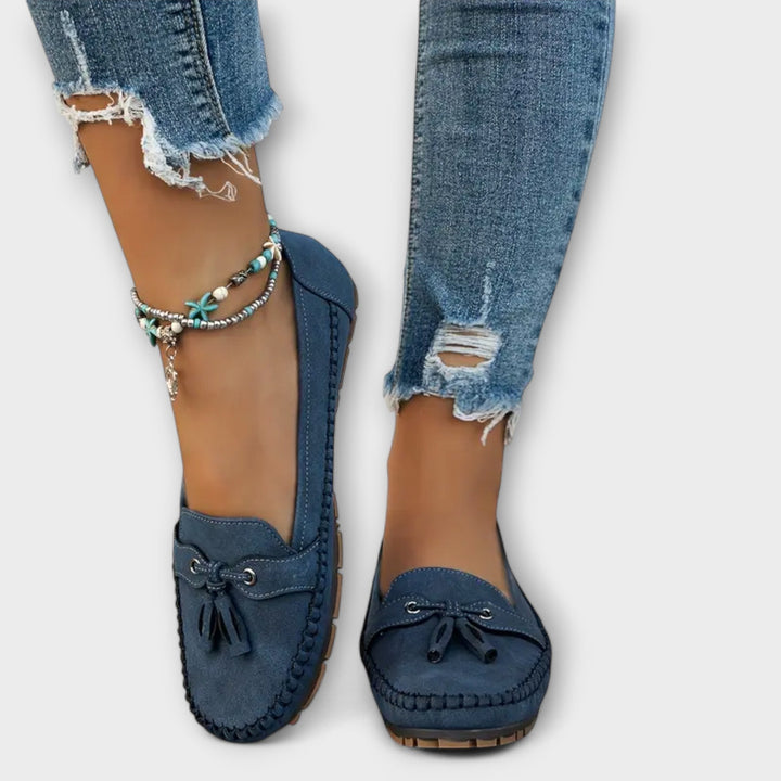 A woman wearing classic loafers on an easy day in town.