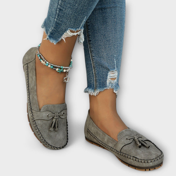 A woman wearing classic loafers on an easy day in town.