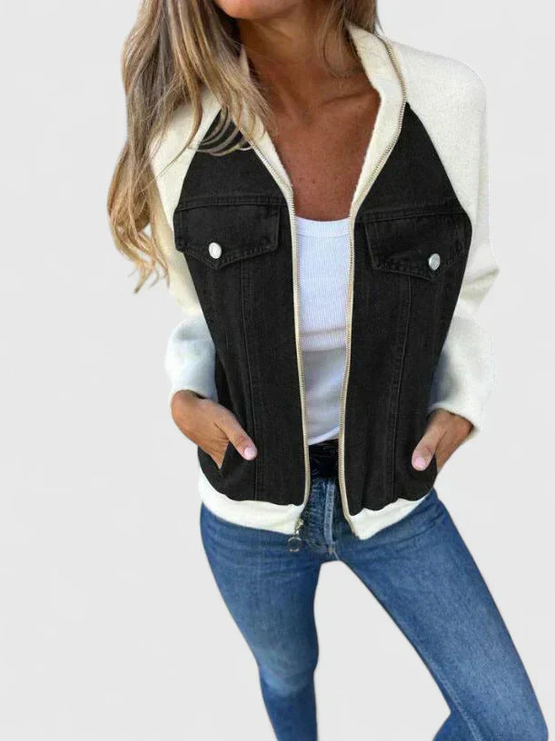A woman wearing a V-neck zip jacket with a relaxed fit