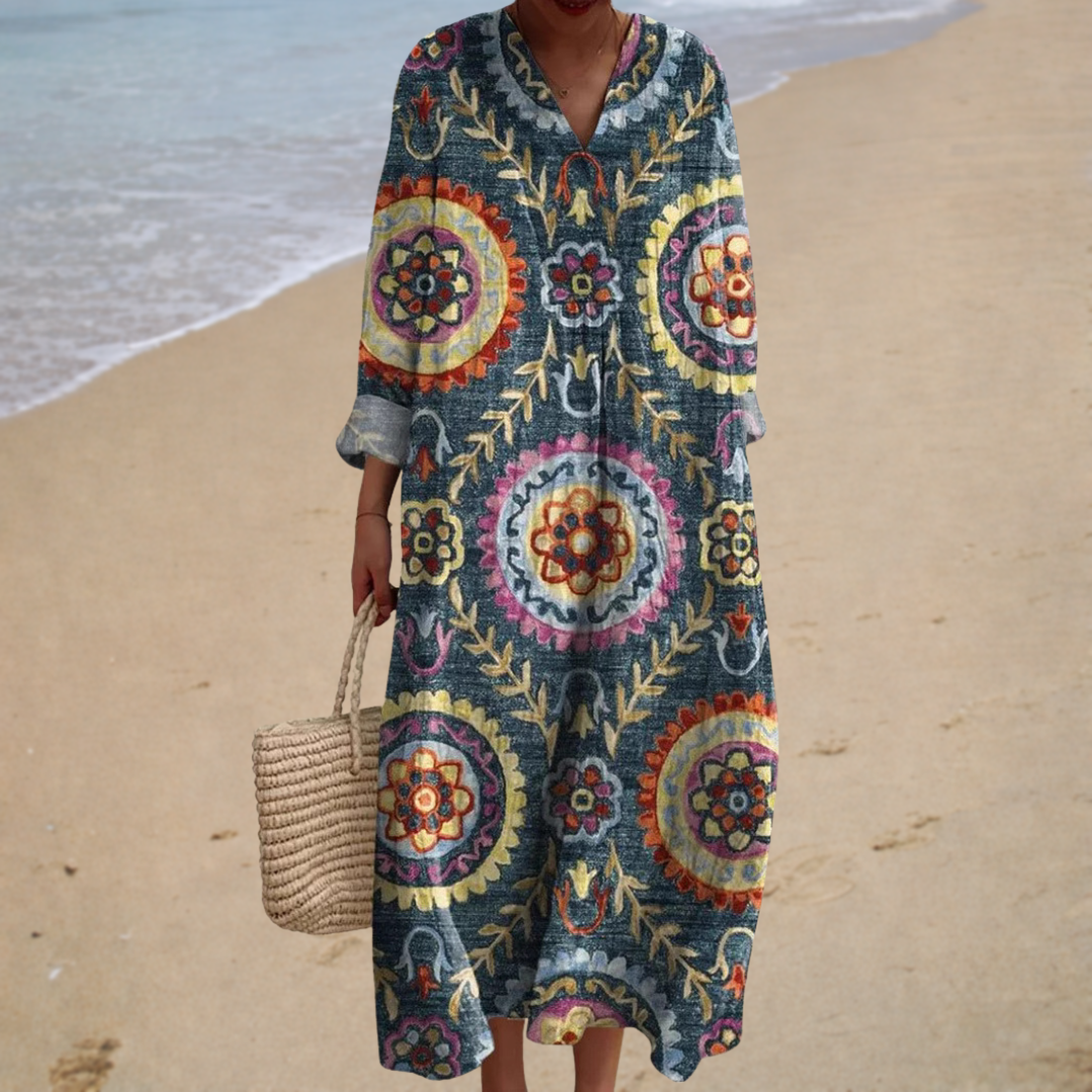 A woman wearing a fluttering printed summer dress that sways softly as she walks in the sun.