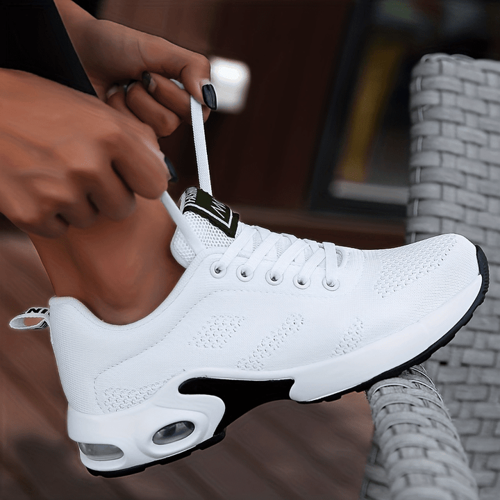 A woman walking further in breathable, air-cushioned non-slip sneakers.