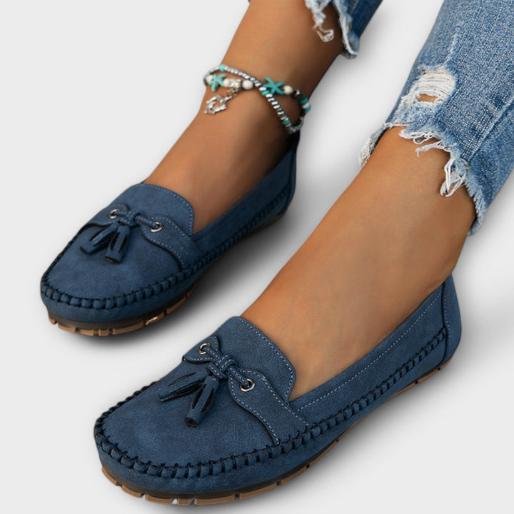 A woman wearing classic loafers on an easy day in town.