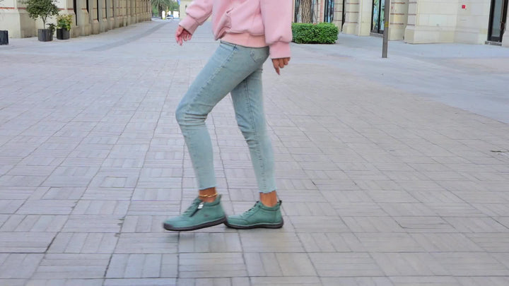 A woman standing comfortably in wide-fit therapeutic comfort shoes